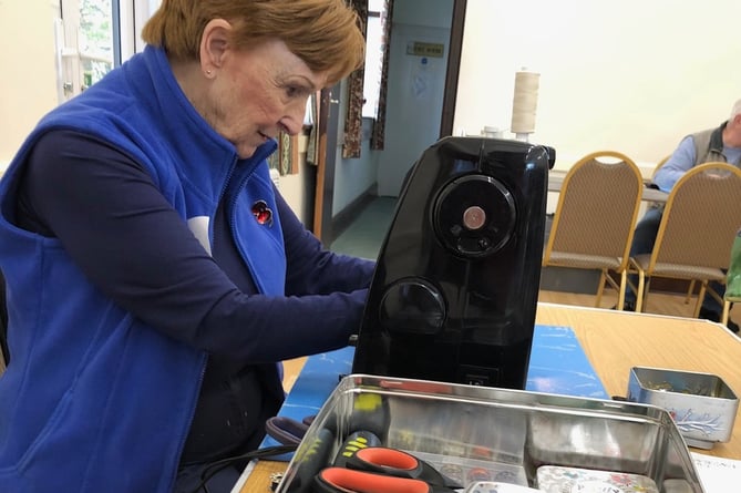 A sewing machine in use at Carhampton Repair Cafe.