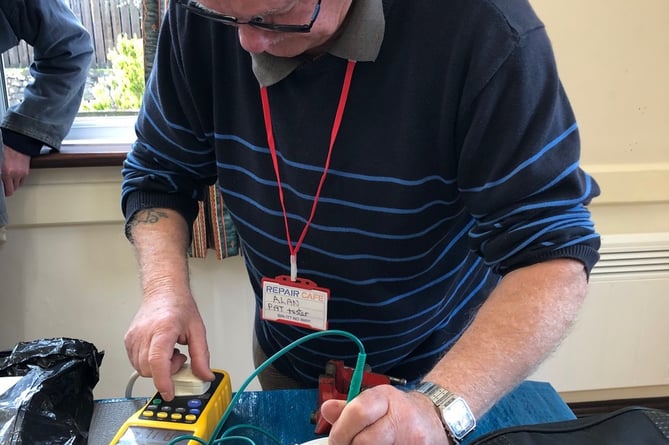 PAT testing electrical items at Carhampton Repair Cafe.