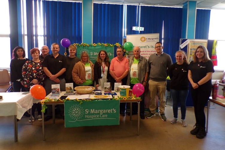 Staff from St Margaret's Hospice and Hinkley Point A meet for a charity cheque presentation.