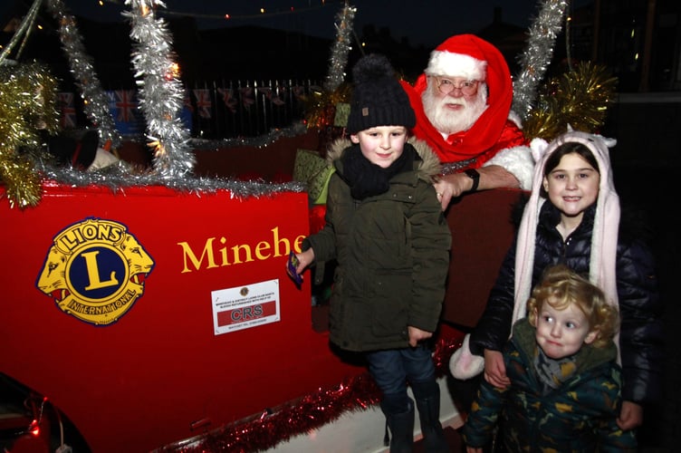 Santa with Eli, aged five, two-year-old Noah, and Holly, aged nine, enjoying Minehead's Christmas lights switch-on.