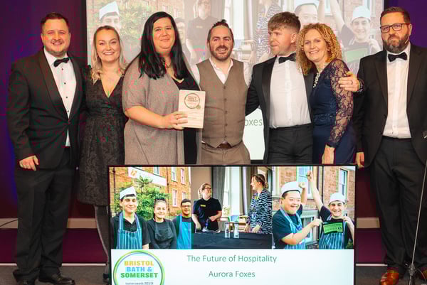 Principal Mark Costello (left), next to winner Zoe Furse and the rest of the Aurora Foxes Team at Bristol Bath and Somerset Tourism Awards.
