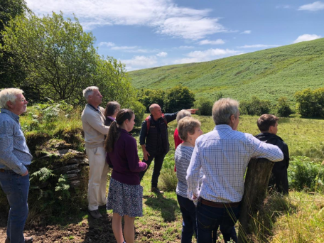 Two generations of the Richards family meet with Exmoor senior woodlands officer Graeme McVittie on the site of the new Kings Wood.