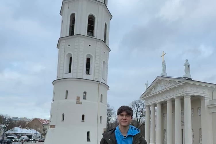 Anthony Knight by the Clock Tower and Cathedral in Vilnius.