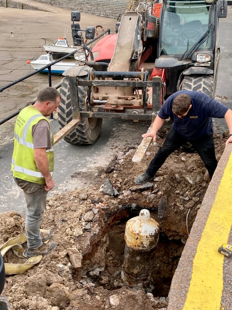 Contractors starting to dig up the Minehead Harbour cannons.