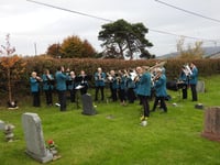 Brass band gives tribute graveside performance