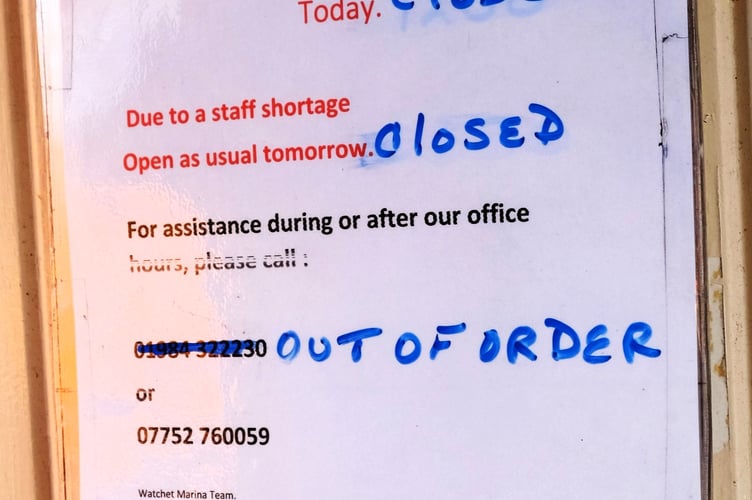 A notice on the door of Watchet Marina's offices.