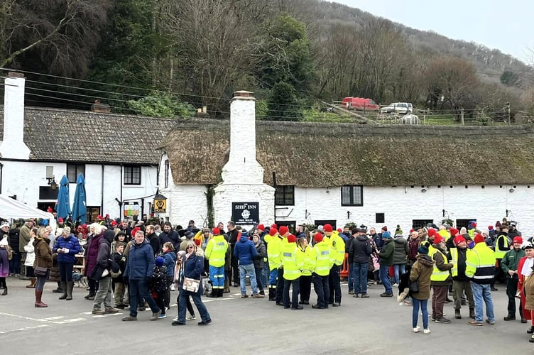 The re-enactment walkers arrive at Porlock Weir.