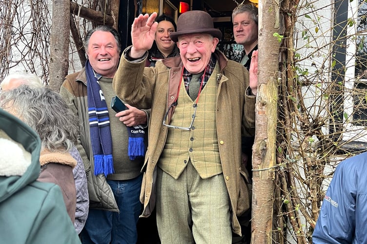 The re-enactment walkers are welcomed at the Top Ship Inn, Porlock.