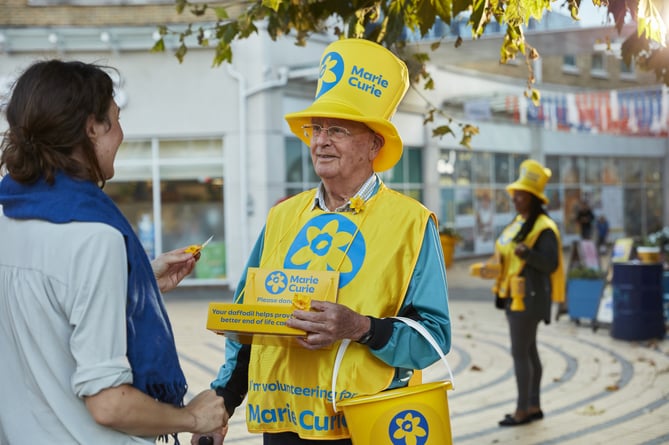 Marie Curie volunteer Mike Clapperton raising funds with the Great Daffodil Appeal last year.