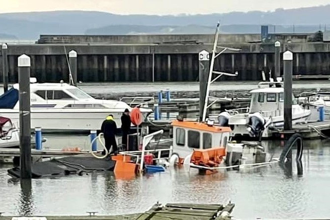 The sinking of the dredger Seaka in Burry Port Marina is being investigated by police.