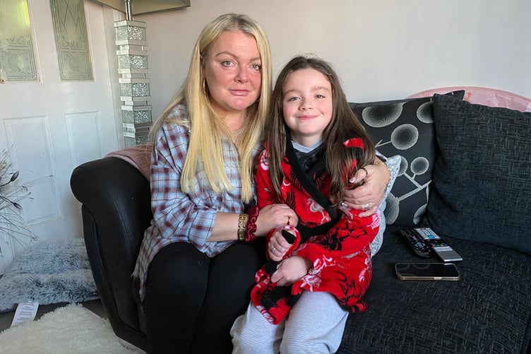 The family have been forced to retreat to the living room to escape damp and crumbling plaster