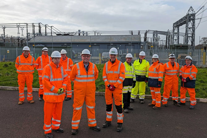 National Grid project director Steven Haskayne (front, centre) with Hinkley Connection Project contractors at the new Sandford sub-station.