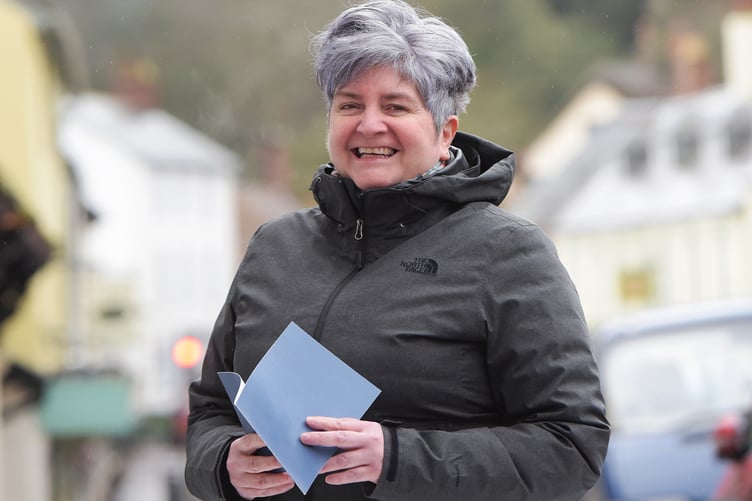Gaynor Gough is delighted with her prize of a gift voucher from the Dunster Living interior shop for coming up with the new event name Dunster Winter Festival.
