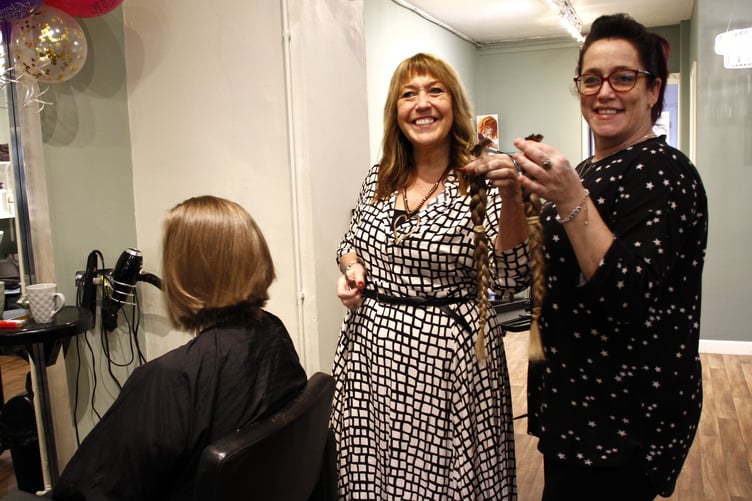 Shades hair and beauty salon owner Gail Barrett and hairdresser Charlene Mills show off their handiwork after Donna Archer's charity haircut.
