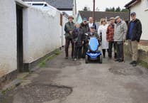 Centenarian and neighbours told by council to fix potholes themselves
