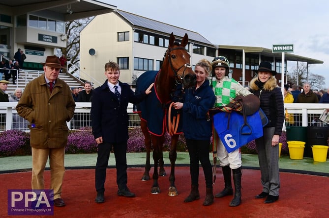 Philip and Sarah Hobbs along with jockey Michael Nolan in the winners enclosure with Into The Park