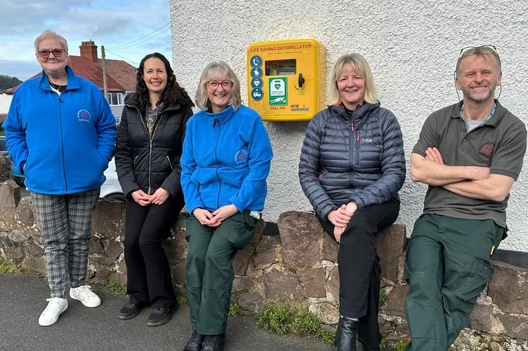 Pictured with the new Minehead defibrillator are (left to right) Hayley Rendell (trustee), Jennie Norris, Diane Newton (trustee), Kat Cross, and Phil Sanderson (trustee).