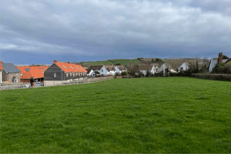 The Hilary Close proposed housing site looking east toward Carhampton.