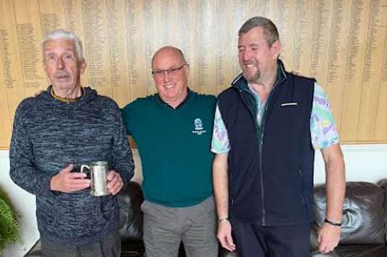 Presentation of the Trafalgar Tankard. Centre: Minehead Seniors' Captain Martyn Westbury (centre) presenting the Tankard to Roger Green (left) and Dave Oatridge (right).