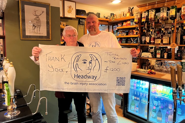Hal Bretherton after his head shave with Lion Inn, Timberscombe, owner Malcolm Passmore.