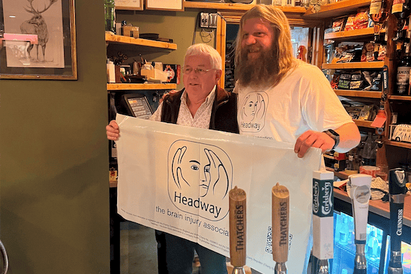 Hal Bretherton before his head shave with Lion Inn, Timberscombe, owner Malcolm Passmore.