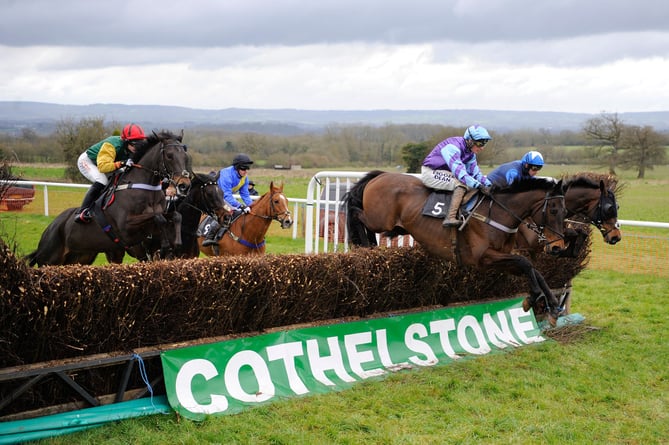 Runners In the Restricted Race take a fence at Cothelstone