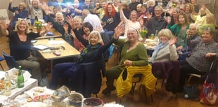 Minehead street choir sing for their supper