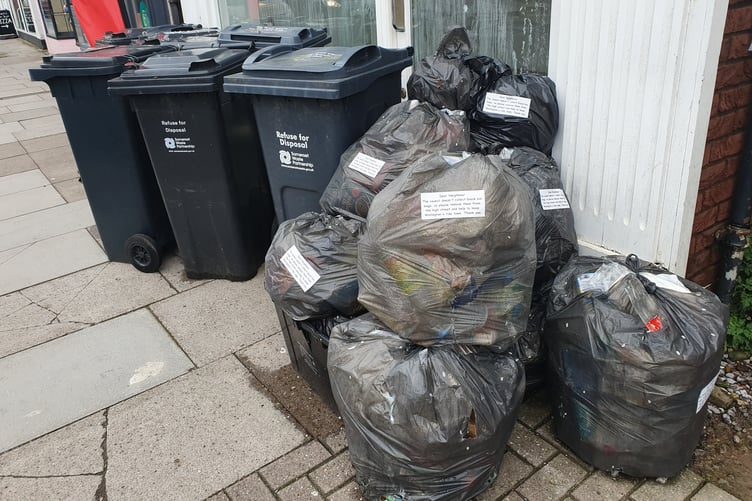 Rubbish bags seen piled up in Wellington High Street