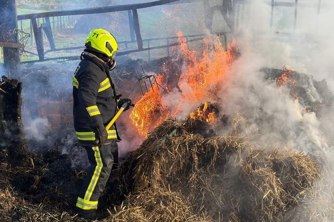Fire fighters used rakes and hoses to tackle the blaze