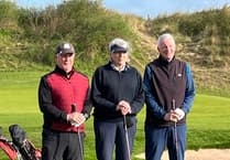 Golf club hand over two fat cheques t


