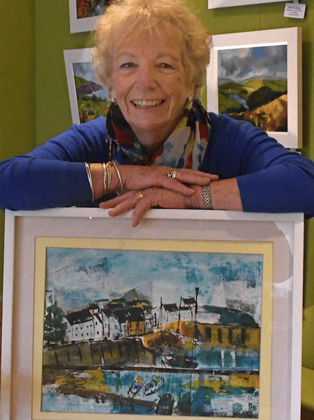 Sue Walsh with her mixed media picture of Watchet Harbour. 