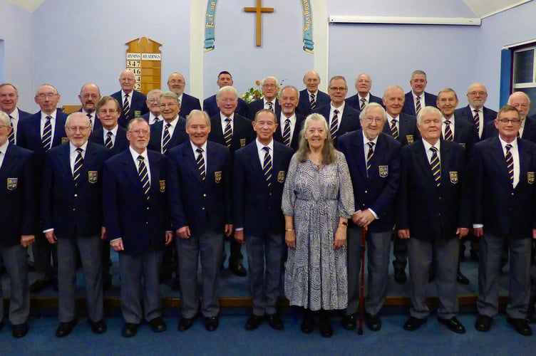 Minehead Male Voice Choir with their musical director Jackie Butterworth.