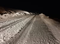 Snow falls on hills as winter hangs on