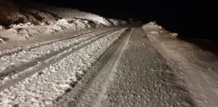 Snow falls on hills as winter hangs on