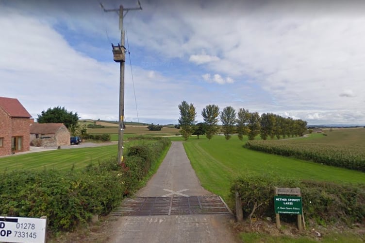 Entrance to the Quantock Lakes HPC park and ride site seen from the A39 near Nether Stowey