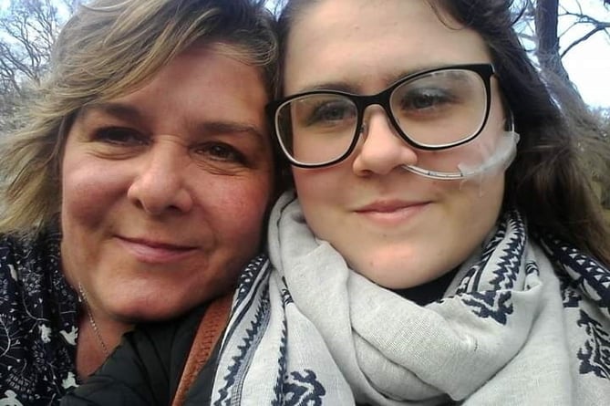 Cariss Stone, 19, with her mum Gina Schiraldi. Release date March 28 2024. The mum of a teen who died after spending five months on a psychiatric intensive care unit hope an inquest will end her five-year wait for answers. Police cadet volunteer Cariss Stone, 19, had been detained under the Mental Health Act when she was found unresponsive in the bathroom of her room. Cariss, known to mental health services since the age of 15, had been detained six times previously and was staying in the Holford Ward at Wellsprings Hospital in Taunton, Somerset. She was on a regime that mandated observations every five-minutes. After being found unresponsive, Cariss was taken to hospital.  However, following advice from doctors, a decision was made to withdraw life-sustaining treatment. She died on 11 August, 2019, two days after she was found in her room.