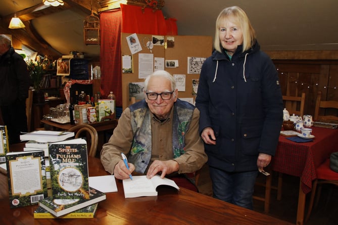 Lynette Turner has her copy of the book signed by Powers Ian Mawby.