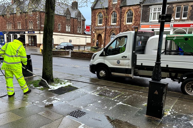 A weed clearance trial under way in the centre of Minehead.