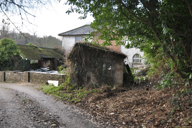 An outbuilding at the Coach House, Huish Champflower, which would be demolished to provide disability vehicle access and parking for a proposed holiday let.