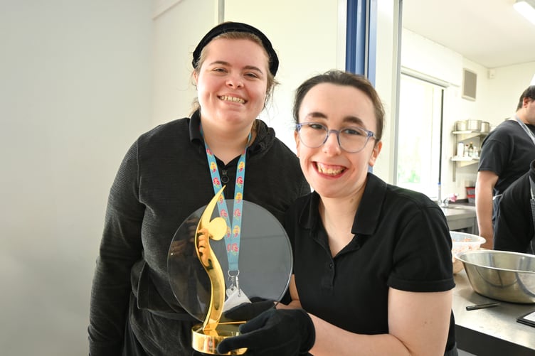 Delighted Aurora Foxes Academy students n the Williton kitchen with their community engagement award.