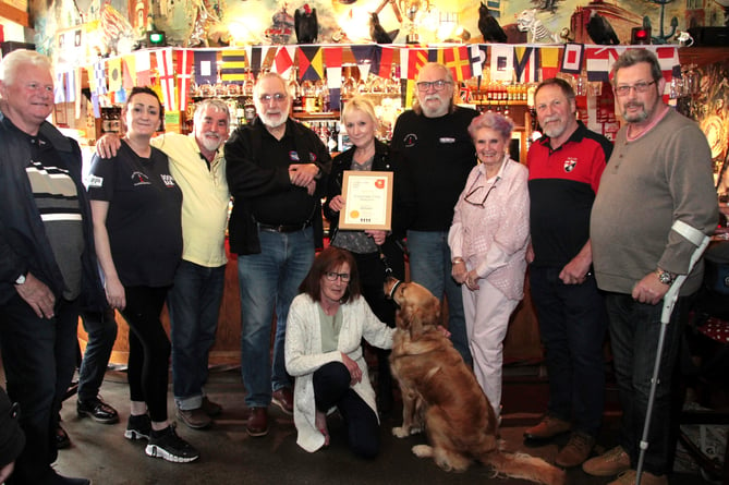 Roy and Helen Chave of the Esplanade Club receive their CAMRA award from Phil Emond (Photo George Ody)