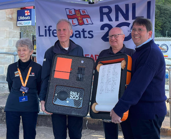 Lifeboat volunteers and supporters sign 200th anniversary scroll