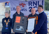 RNLI 200th scroll with 'One Crew' pledge is signed by Minehead crew and volunteers