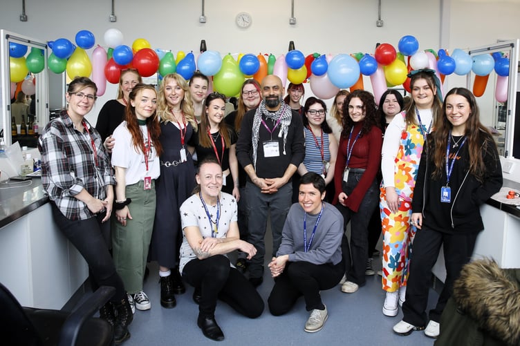 Sangeet Prabhaker (centre) is pictured with UCS students and staff at an event celebrating his collaboration with the college.