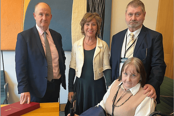 MP Rebecca Pow (centre) introduces Post Office Minister Kevin Hollinrake (left) to former postmaster Steve Marston and his wife.