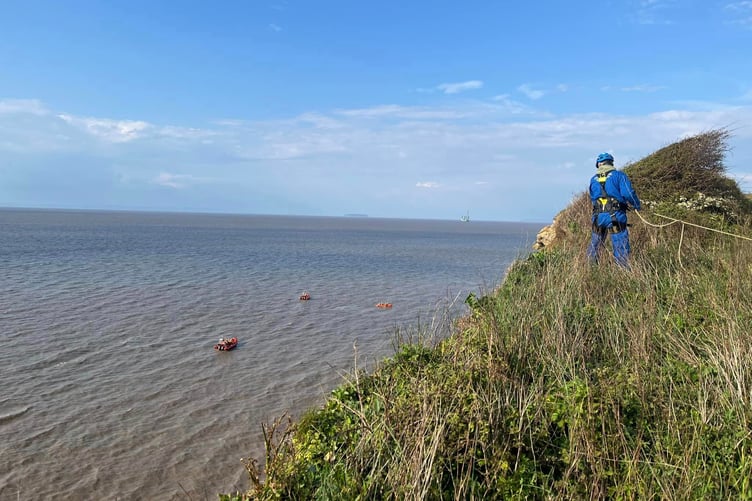 Coastguard and lifeboat crews at the scene of a rescue of a dog walker trapped by the tide near Kilve on Bank holiday Monday.