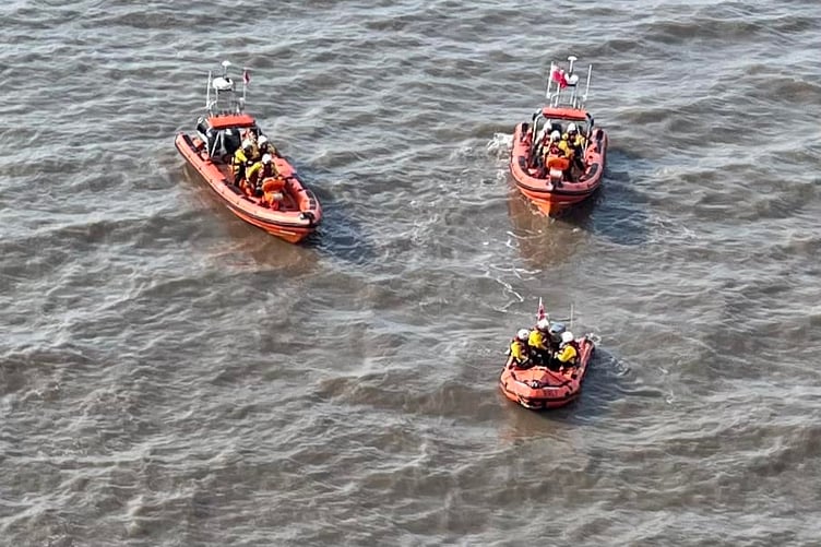 Minehead and Burnham-on-Sea lifeboat crews prepare to rescue a dog walker trapped by the tide near Kilve on Bank holiday Monday.