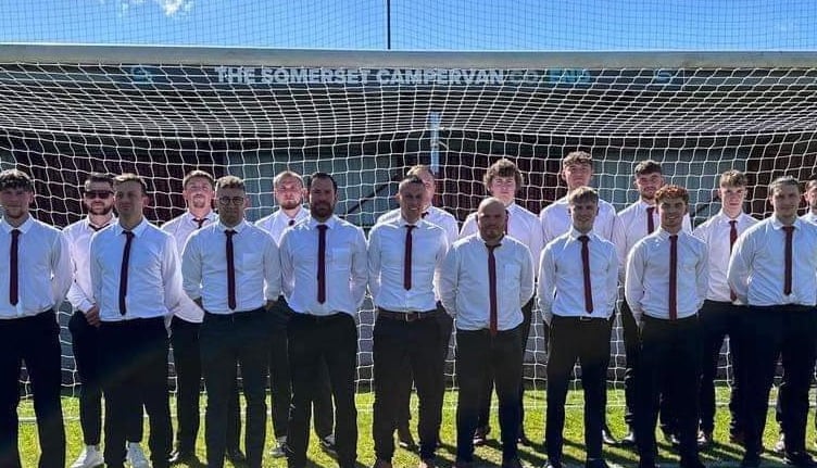 Porlock line up along with John Healy and chairman Graham Sizer; from left to right, back: Bogdan Aldei, Karl Middleton-Smith, Ryan Parsons, Chris James, Jack Richards, Chris Barrett, Jari High, Finley Priddle and Mike Mullen ; front: Braden Taylor, Zac Brown, Adam Langdon, Jay Horne, Callum Barnfield, Jack Evans, Beau Winter and Gavin Paviour