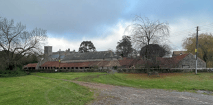 Village's ancient barn needs roof repairs before it collapses