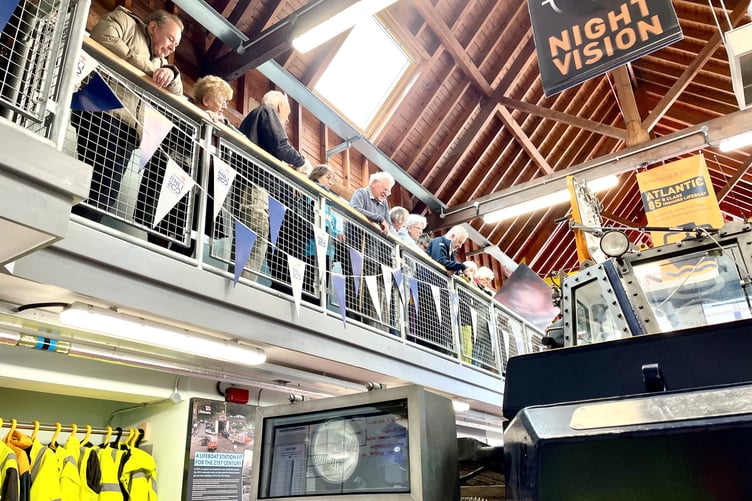 Visiting women's institute members are shown around the Minehead RNLI Station by visits officer Eric Atkins.